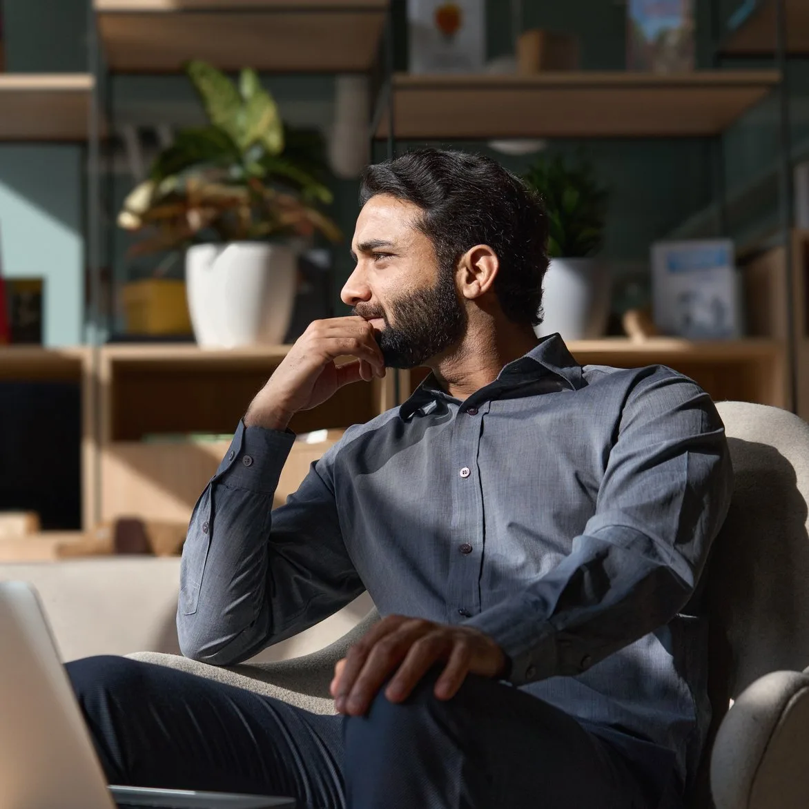 Property manager relaxed at his desk while the AI handles the day to day